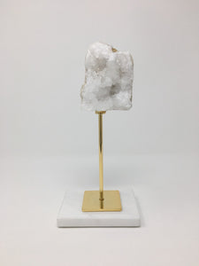 White Stone on Gold Stand