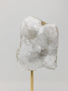 White Stone on Gold Stand